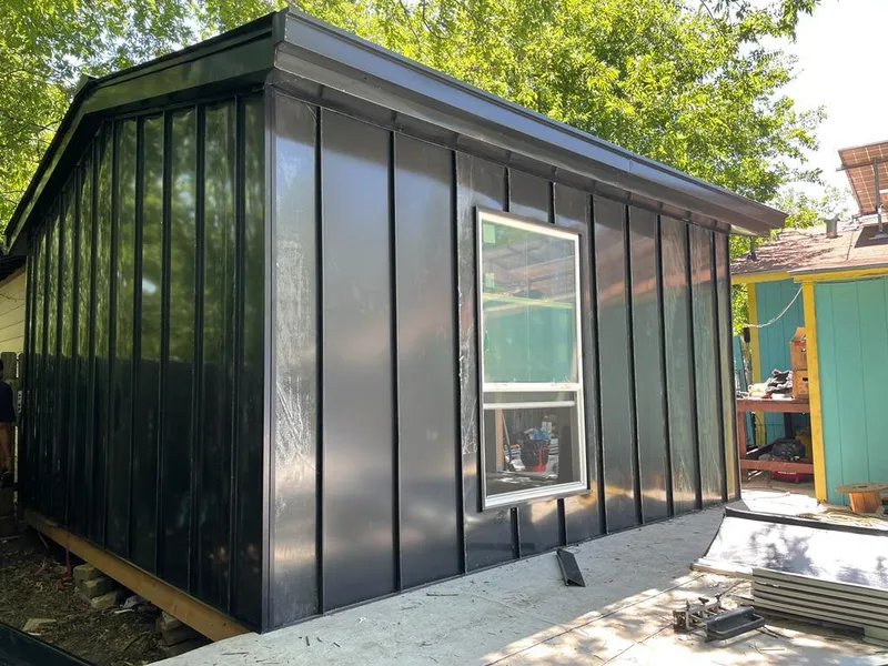 Black standing seam metal wall panels for Roof Inspection in Newport Beach